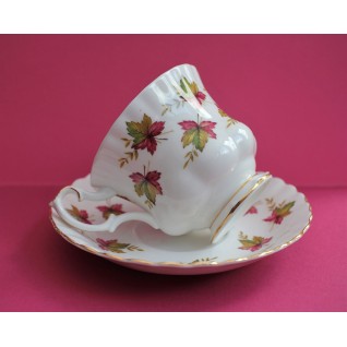 Cup and saucer with maple...